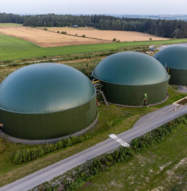 Agricultural consultant working with farmer in field with modern equipment